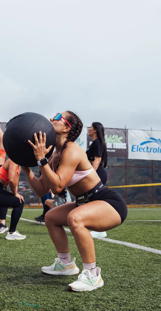 Wall ball at the bottom of a squat